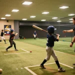Hit club baseball training session with players actively practicing swings and techniques.